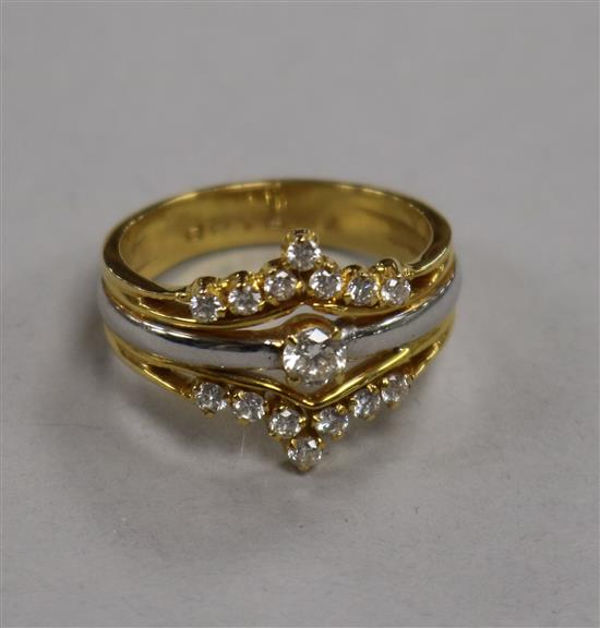 A yellow metal and white metal diamond set dress ring, size Q.